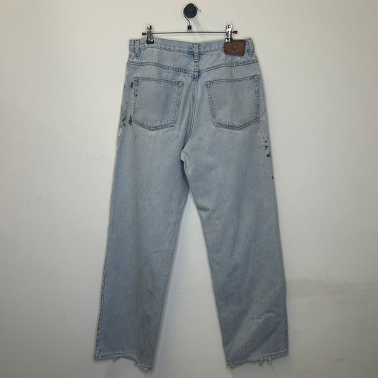 PREOWNED EDDIE BAUER LIGHT DENIM PAINT NAVY BLUE SPLAT 33x32