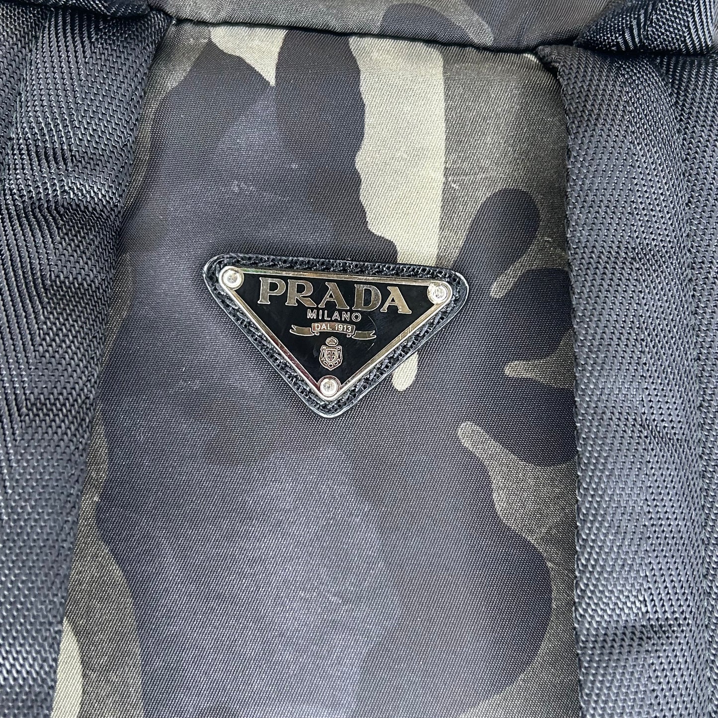 PRADA ENAMELED METAL TRIANGLE BACKPACK