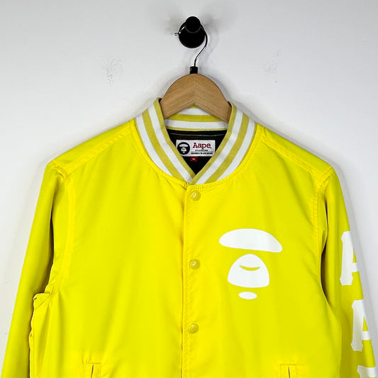 AAPE MOONFACE LOGO BOMBER JACKET YELLOW