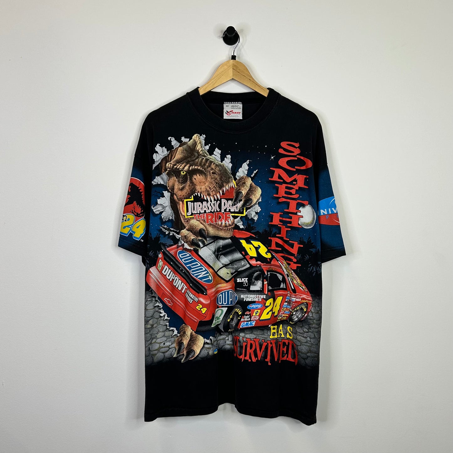 1997 JURASSIC PARK SOMETHING HAS SURVIVED RACING TEE