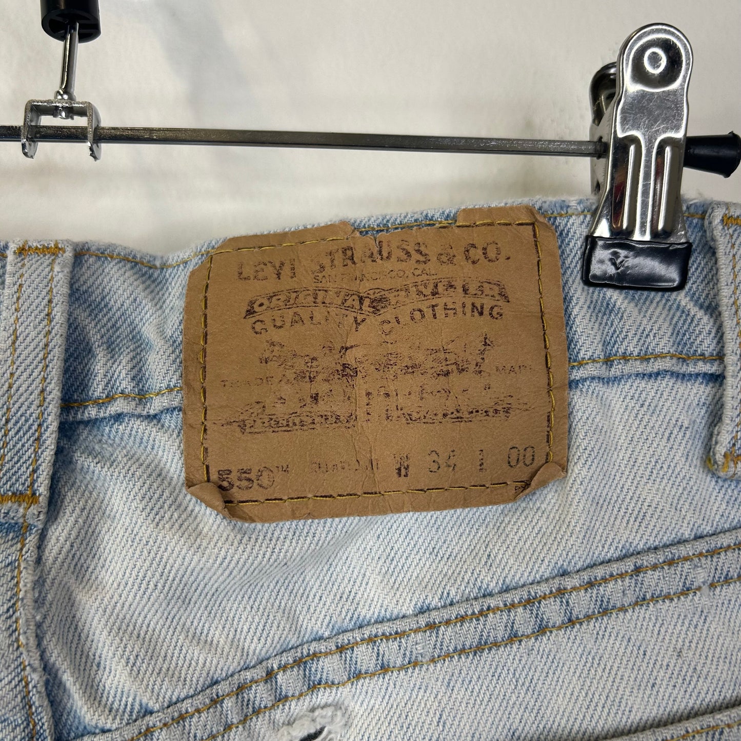 LEVIS 550 BLUE JORTS ORANGE TAB