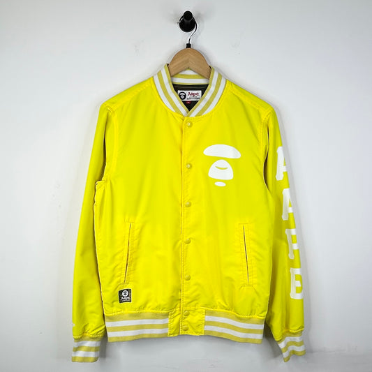 AAPE MOONFACE LOGO BOMBER JACKET YELLOW