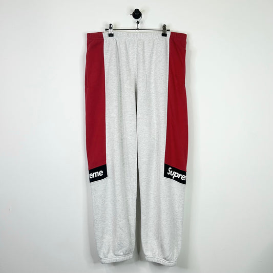 SUPREME RED GREY COLOR BLOCK SWEATPANTS