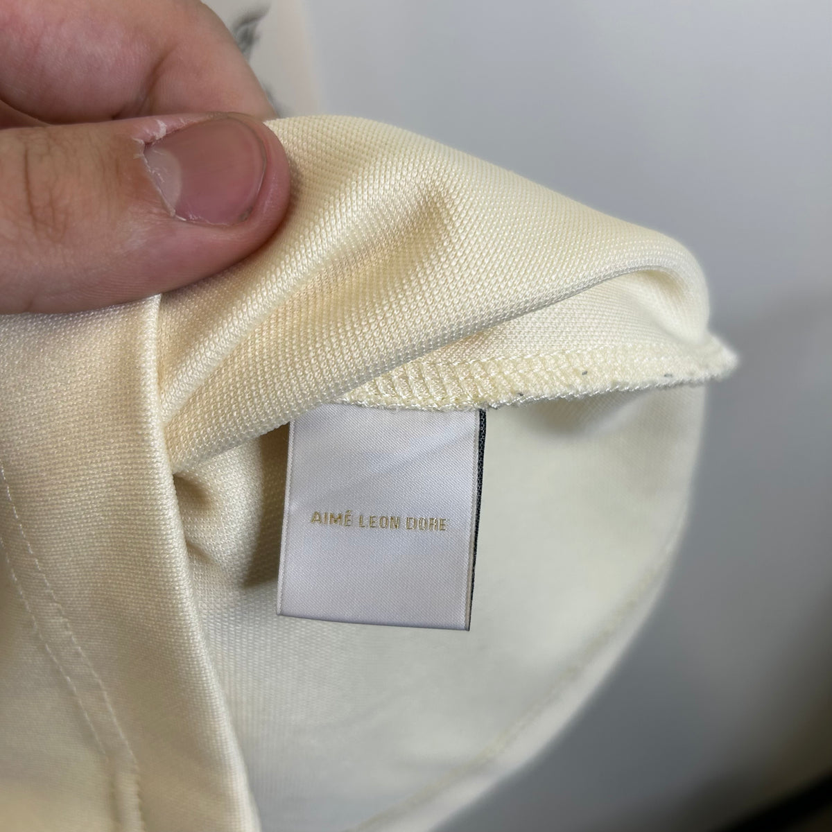 AIME LEON DORE X NEW BALANCE COLLARED CREAM TEE
